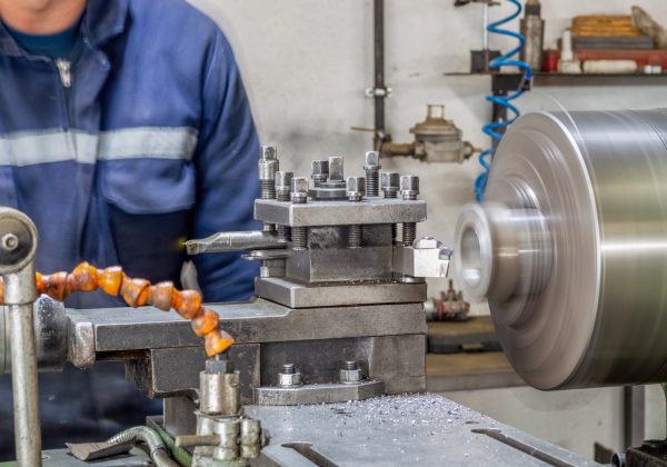 blue-collar-machine-operator-working-with-lathe-machine-in-a-factory_t20_LzQxaP.jpg